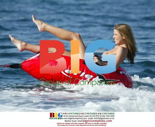 FHM Babe Tanya Robinson Surfing Donut