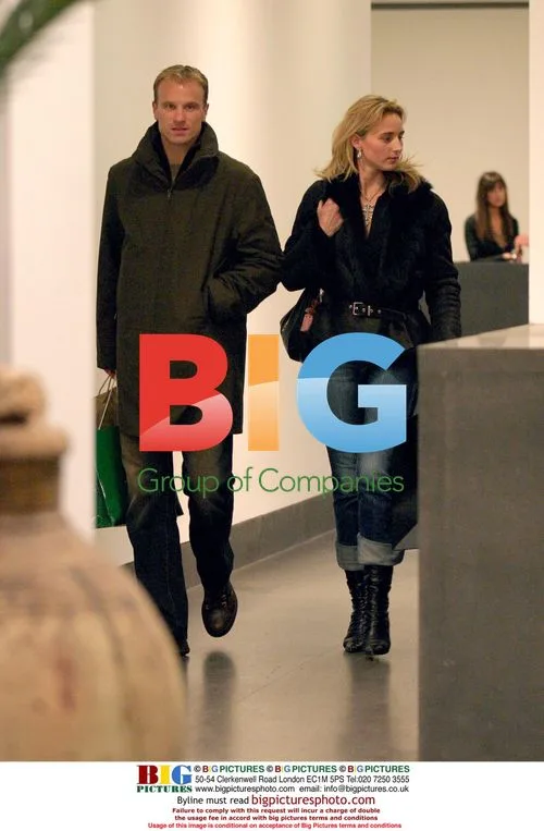 Dennis Bergkamp shops with wife in London