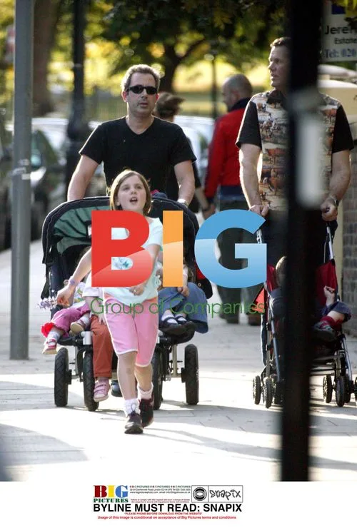 Ben Elton and family on London walk
