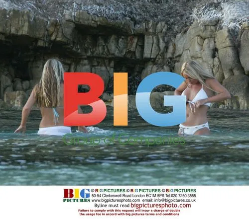 Glamour model Ebony and actress Annie at beach