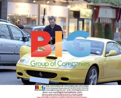Eric Clapton Gets Into Yellow Ferrari