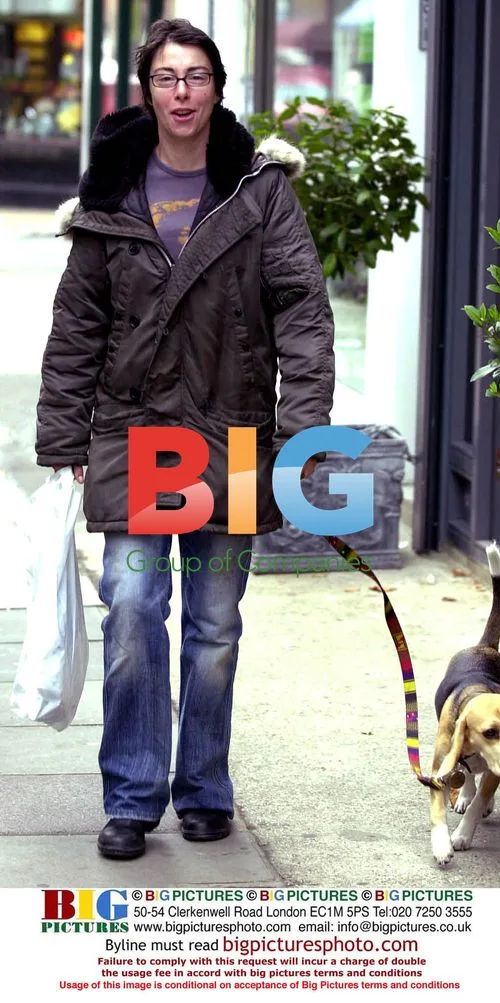TV presenter Sue Perkins walking dog
