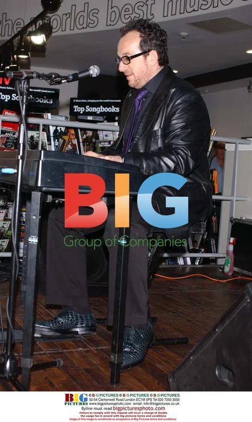 Elvis Costello performs at HMV store