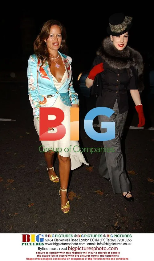 Celebrity Duo Poses at Event
