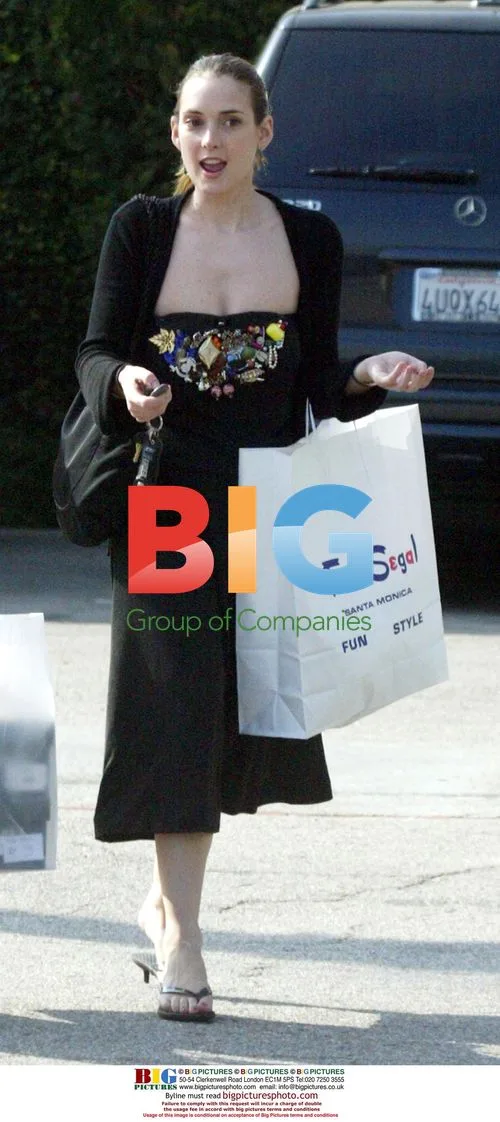 Winona Ryder takes smoke break during shopping spree