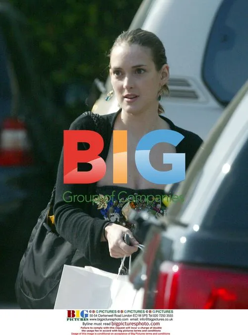 Winona Ryder Takes Smoke Break During Shopping