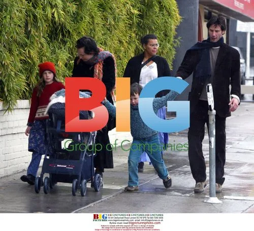 Keanu Reeves Evades Rain with Niece