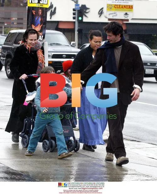 Keanu Reeves Plays with Niece in LA Rain