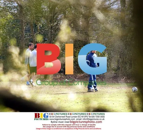 Robbie Williams and Jonathan Wilkes playing football