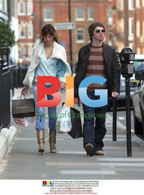 Noel Gallagher and Sara MacDonald return home from shopping