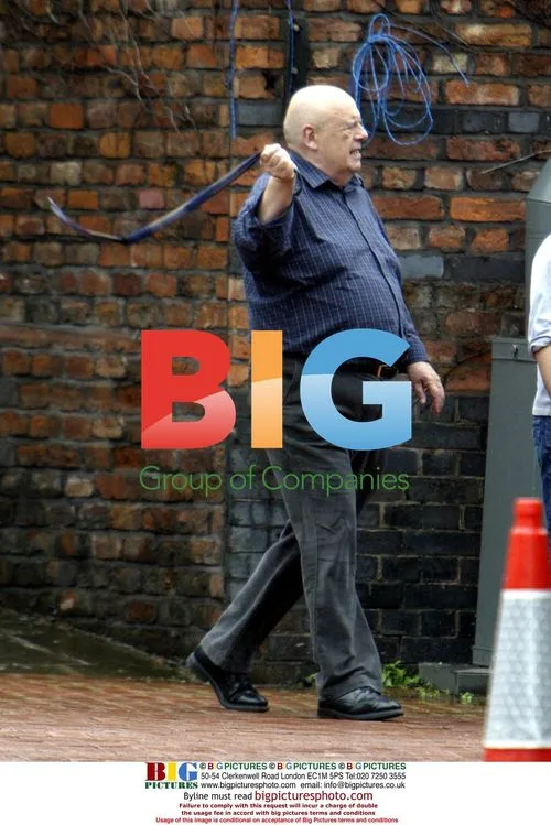 John Savident swinging rope at Coronation Street set