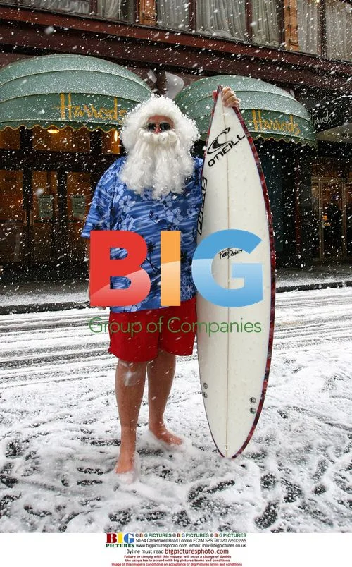 Cool Santa in Bermudas and Surfboard at Harrods