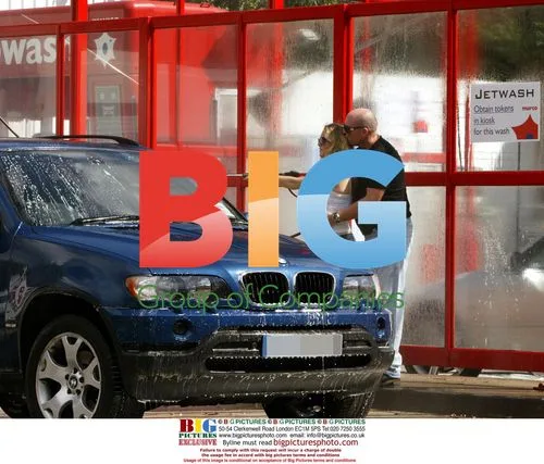 Pregnant Charlie Brooks Cleans BMW with Boyfriend