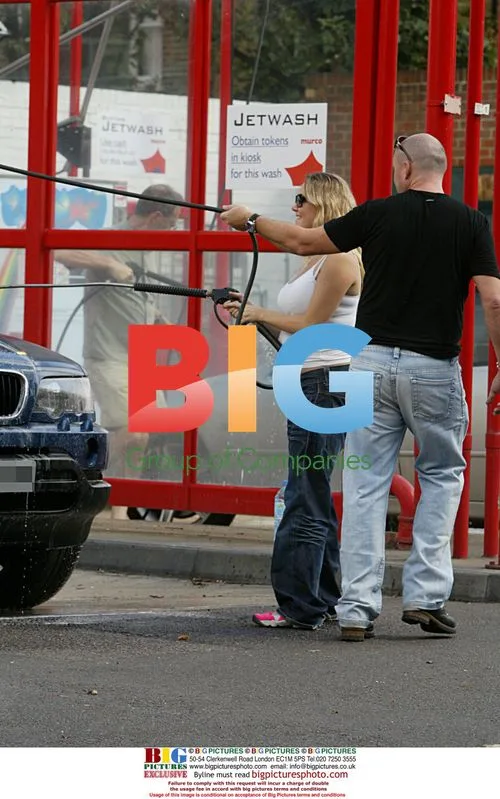 Pregnant Charlie Brooks Cleans Car with Boyfriend