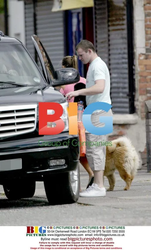 Wayne Rooney and Coleen with Dog