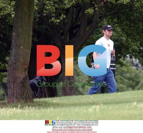 James Dreyfus Walking Dogs in Park