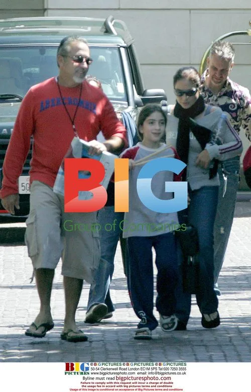 Gloria Esterfan with Family Leaving Hotel