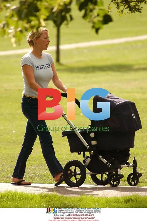 DJ Sara Cox out with baby in London park