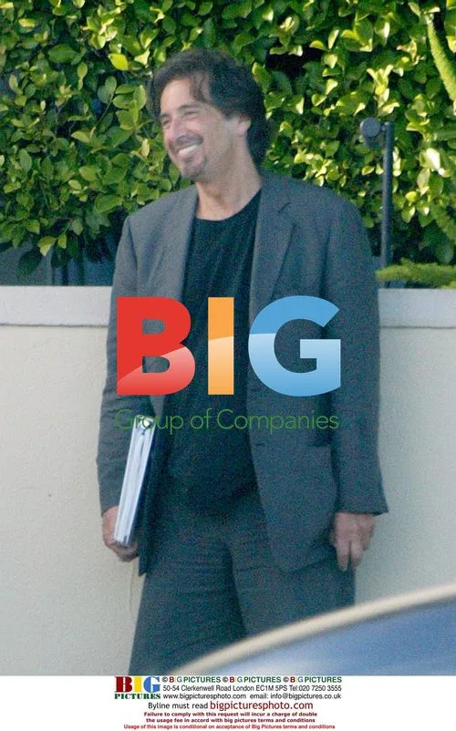 Al Pacino and Rene Russo Laugh Outside Hotel