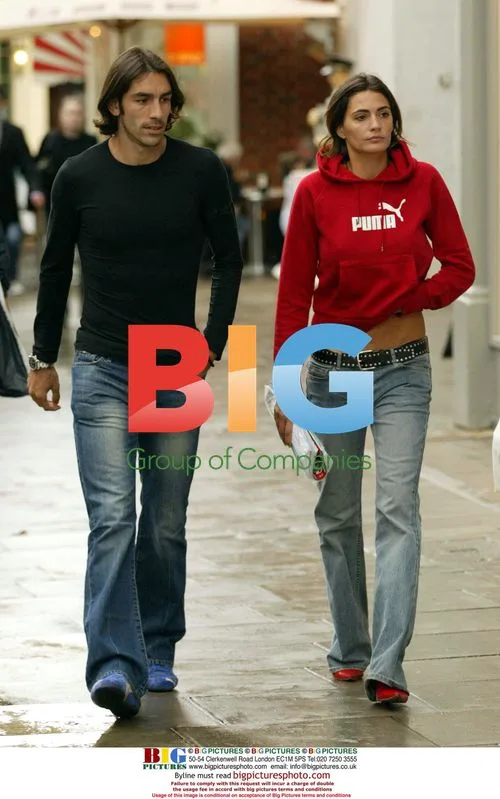 Robert Pires dodges rain in London