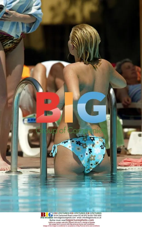 Glamour models Michelle Marsh and Jo Hicks poolside