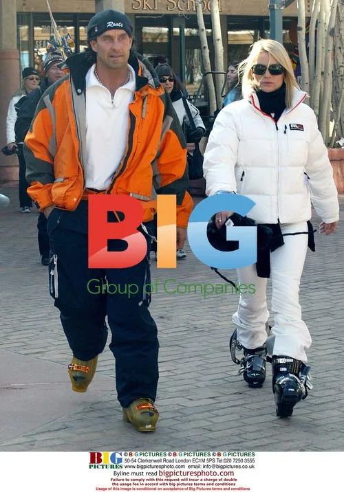 Nicolette Sheridan with ski instructor in Aspen