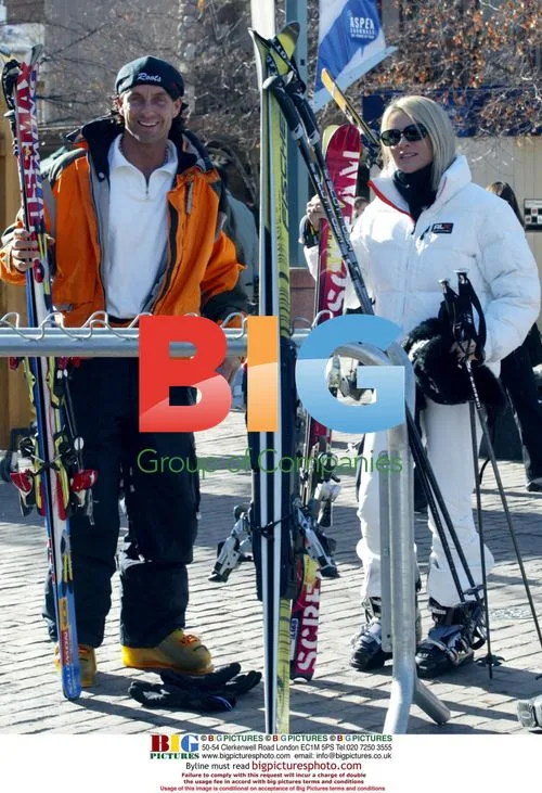 Nicolette Sheridan skiing with instructor