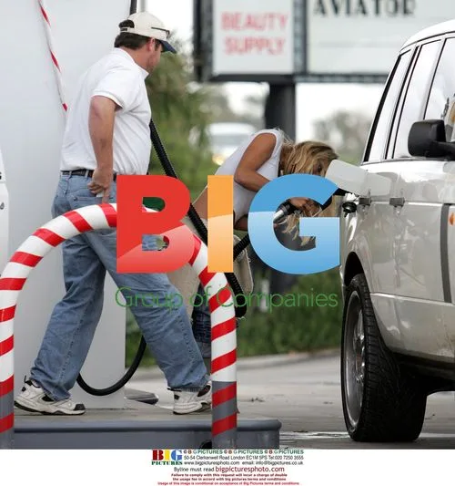Pamela Anderson Struggles at Gas Pump