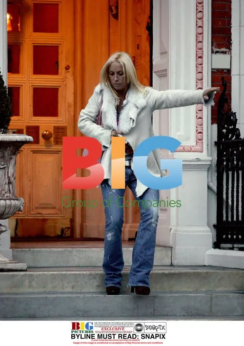 Meg Matthews Hailing Cab in London