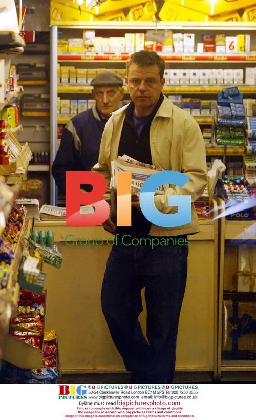 Suggs Buying Newspaper in Hampstead