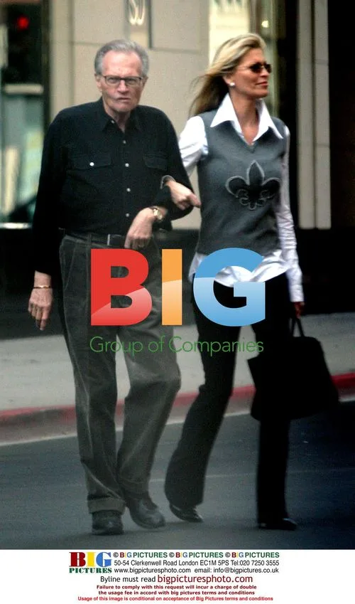 Larry King and Shawn Southwick-King stroll in Beverly Hills