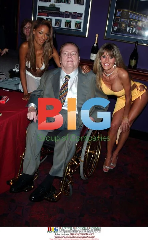 LARRY FLYNT signs books at Hustler Club