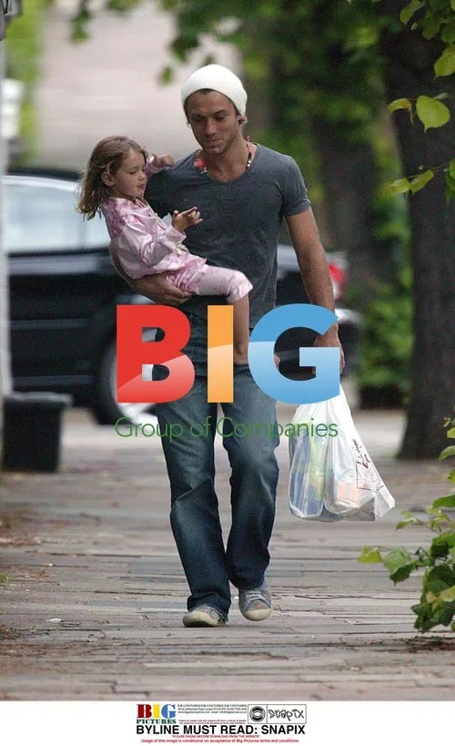 Jude Law carries daughter Iris