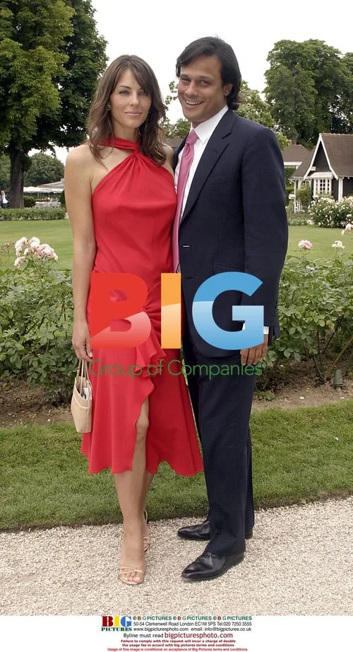 Liz Hurley and Arun Nayar at Dior show