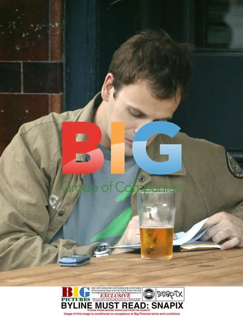 Jonny Lee Miller Writing Outside Pub