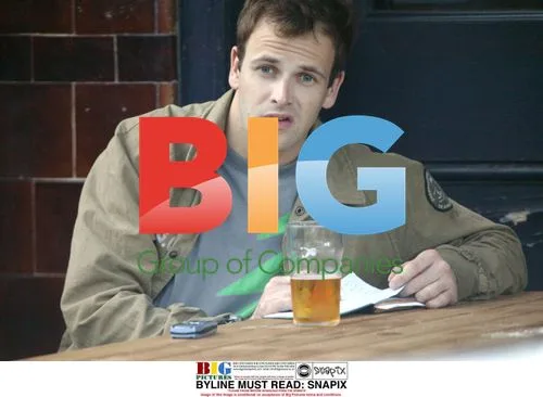 Jonny Lee Miller Writing Outside Pub