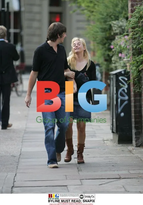 Gail Hipgrave hiding behind husband Dan