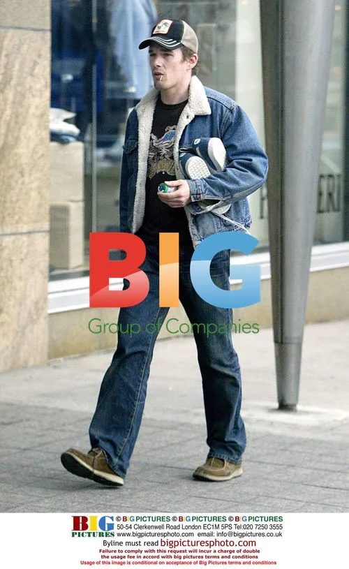 Ethan Hawke on phone during dog walk