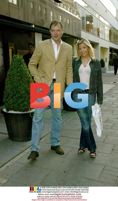 John Leslie and girlfriend at book launch