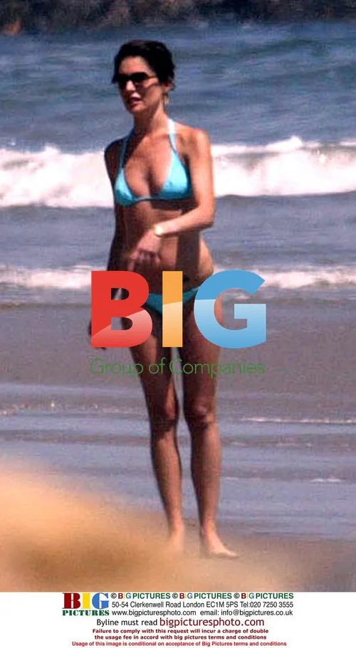 Lara Flynn-Boyle Relaxes at Malibu Beach