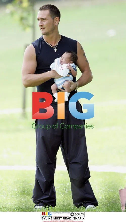 Will Mellor with girlfriend and baby in park