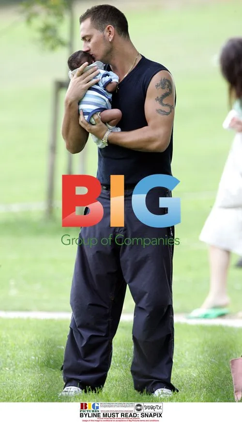 Actor Will Mellor and girlfriend with baby in park