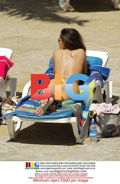 Page 3 models tanning by pool in Tenerife