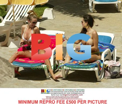 Page 3 models tanning by pool in Tenerife