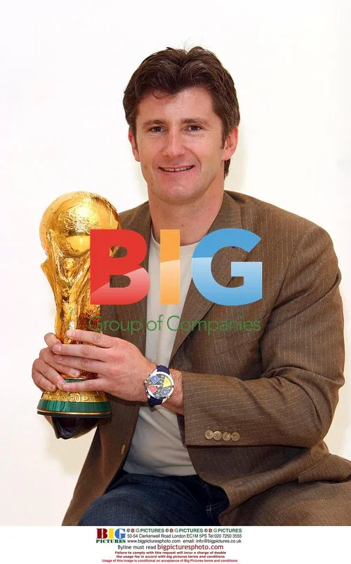 FIFA officials with World Cup trophy