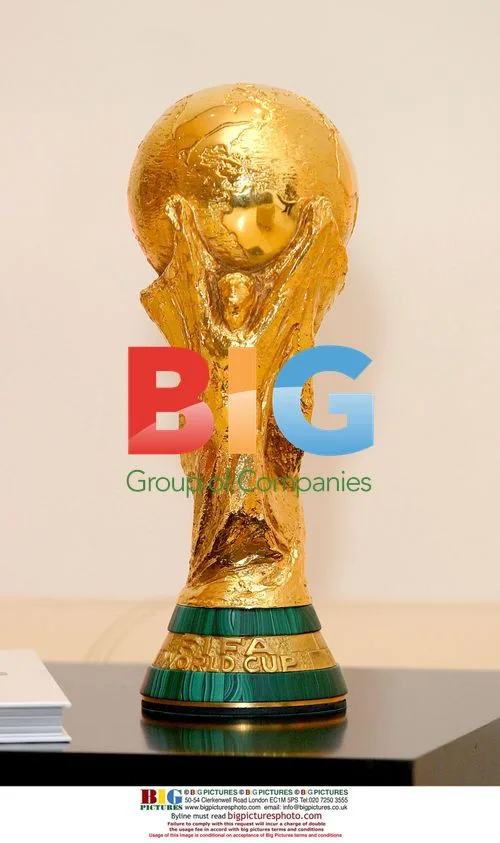 FIFA officials with World Cup trophy