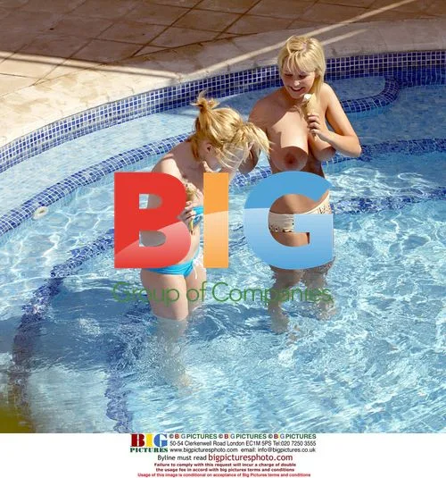 Glamour models Michelle and Jo by pool