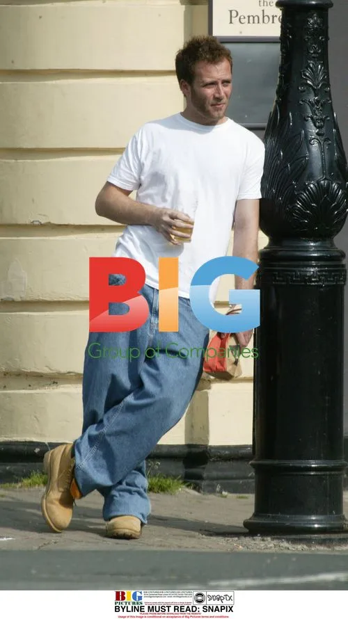 Jason Brown with Drink and Bag