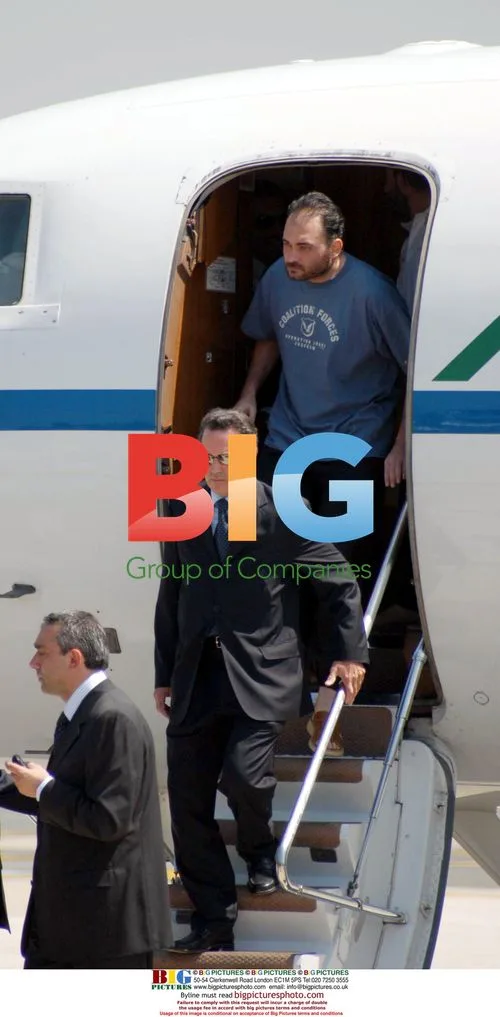 Freed Italian Hostages Arrive in Italy