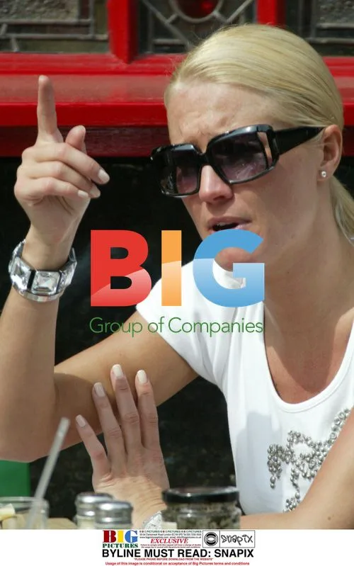 Denise Van Outen tanning outside pub